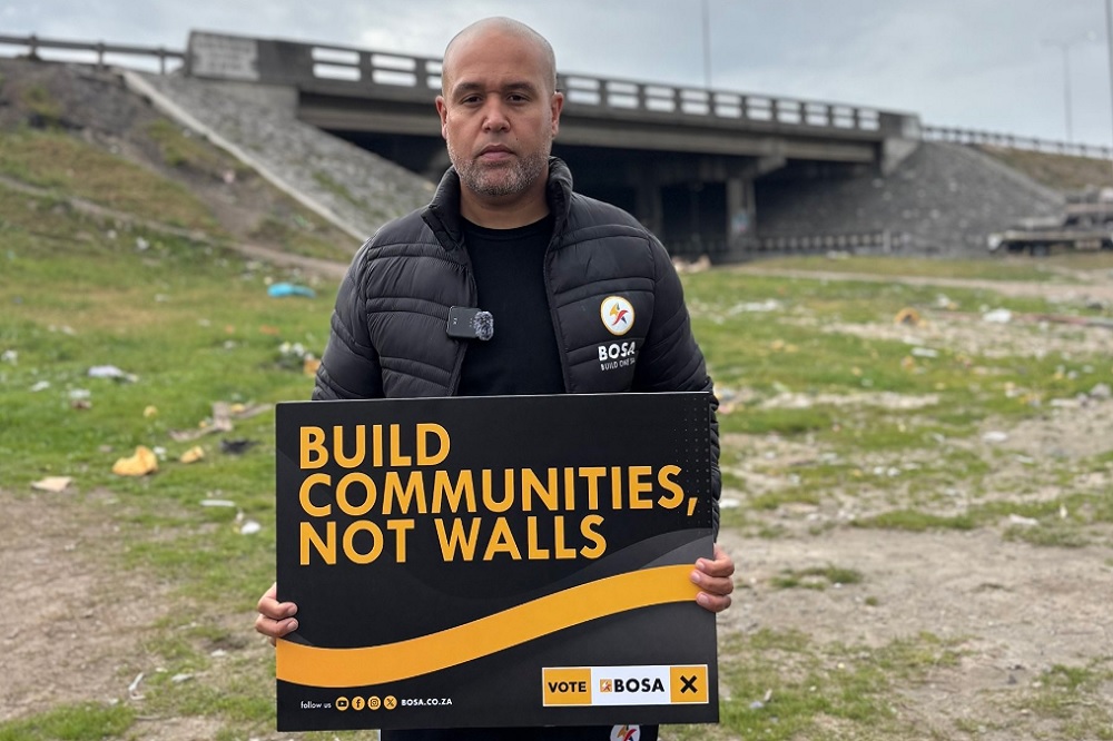 BOSA's mayoral candidate for Cape Town, Roger Solomons holds a placard calling for local government to build communities.